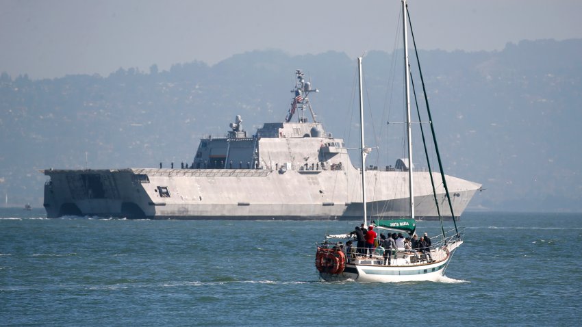 People on a boat watch the Independence-class combat ship USS Manchester sail on the bay during the parade of ships kicking off Fleet Week festivities in San Francisco, Calif. on Friday, Oct. 5, 2018. (Photo By Paul Chinn/The San Francisco Chronicle via Getty Images)