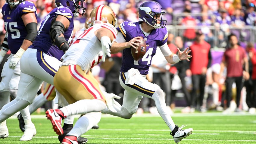 MINNEAPOLIS, MINNESOTA – SEPTEMBER 15: Quarterback Sam Darnold #14 of the Minnesota Vikings looks to pass against the San Francisco 49ers during the third quarter at U.S. Bank Stadium on September 15, 2024 in Minneapolis, Minnesota. (Photo by Stephen Maturen/Getty Images)