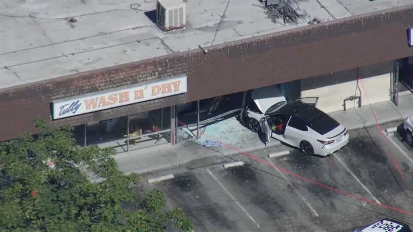 Car at rest after crashing into a laundromat in East San Jose.