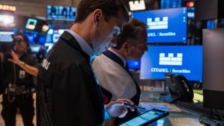 NEW YORK, NEW YORK – OCTOBER 22: Traders work on the floor of the New York Stock Exchange (NYSE) on October 22, 2024 in New York City. The Dow was down over 100 points in morning trading following a drop of over 300 on Monday. (Photo by Spencer Platt/Getty Images)