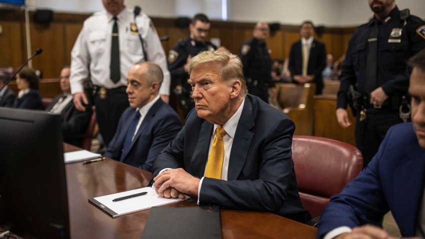 Former President Donald Trump sits in a courtroom between his lawyers Emil Bove, left, and Todd Blanche, right, before the start of the day’s proceedings in the Manhattan Criminal court, Tuesday, May 21, 2024, in New York.