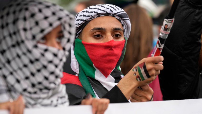 Women attend at a protest in Rome, Saturday, Oct. 5, 2024. Pro-palestinians people take to the street in an unauthorised march in the centre of Rome two days ahead of the first anniversary of the Oct. 7.