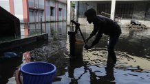 A man tries to collect fresh drinking water