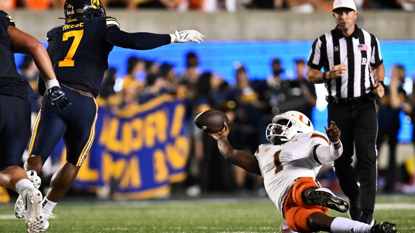 BERKELEY, CALIFORNIA – OCTOBER 05: Cam Ward #1 of the Miami Hurricanes gets attempts to get rid of the ball against the California Golden Bears in the second quarter at California Memorial Stadium on October 05, 2024 in Berkeley, California. (Photo by Eakin Howard/Getty Images)