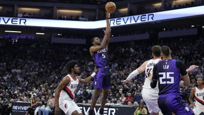 SACRAMENTO, CALIFORNIA – OCTOBER 28: De’Aaron Fox #5 of the Sacramento Kings shoots over Scoot Henderson #00 of the Portland Trail Blazers during the first quarter at Golden 1 Center on October 28, 2024 in Sacramento, California. NOTE TO USER: User expressly acknowledges and agrees that, by downloading and or using this photograph, User is consenting to the terms and conditions of the Getty Images License Agreement. (Photo by Thearon W. Henderson/Getty Images)