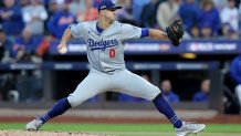 Oct 18, 2024; New York City, New York, USA; Los Angeles Dodgers starting pitcher Jack Flaherty (0) pitches against the New York Mets during the second inning of game five of the NLCS during the 2024 MLB playoffs at Citi Field. Mandatory Credit: Brad Penner-Imagn Images