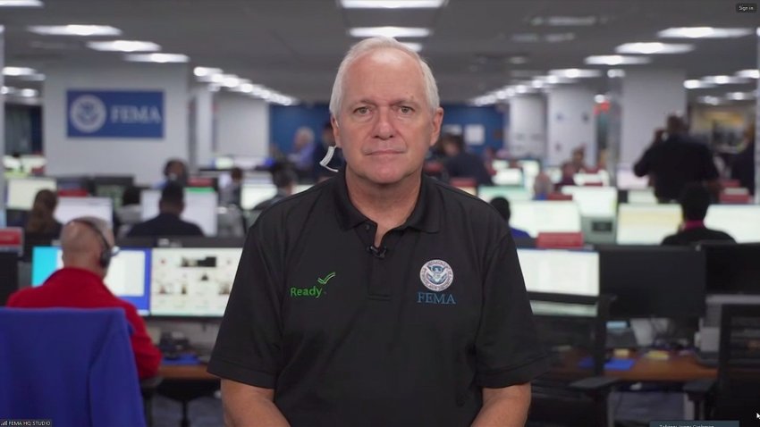 FEMA spokesman stands center of screen in headquarters