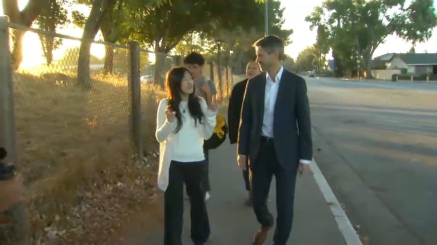 San Jose Mayor Matt Mahan walks to KIPP San Jose Collegiate Academy with a student. (Oct. 9, 2024)