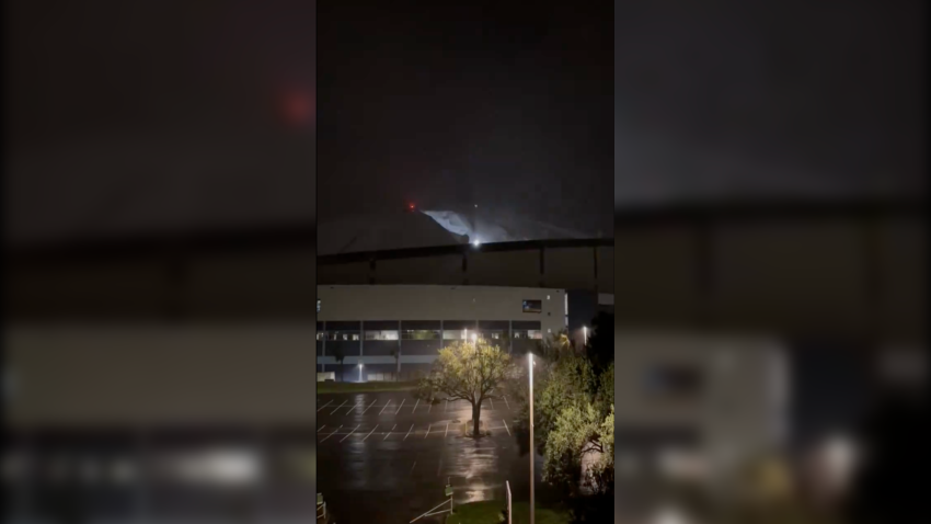 Tropicana Field's roof is torn apart amid Hurricane Milton's strong winds.