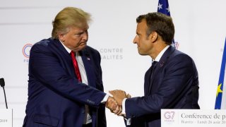 Donald Trump (L), President of the USA, and Emmanuel Macron, President of France, join hands during the final press conference of the G7 Summit on 26 August 2019, in Biarritz, France.