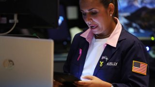 A trader works on the floor of the New York Stock Exchange ahead of the closing bell on Aug. 5, 2024.