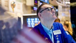 Traders work on the floor of the New York Stock Exchange. 