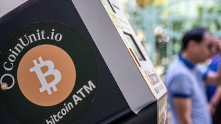 Signage for Bitcoin cryptocurrency on a cryptocurrency ATM, operated by Coinunit.io, in Hong Kong, China, on Wednesday, Nov. 6, 2024.