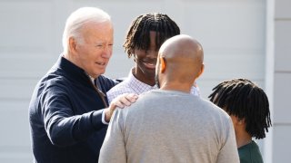 President Joe Biden greets a family for a conversation about student loan debt forgiveness at their home in Raleigh, North Carolina on January 18, 2024.