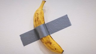 Italian visual artist Maurizio Cattelan’s duct-taped Banana entitled “Comedian,” is on display during a media preview at Sotheby’s in New York, on November 8, 2024. 