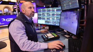 Traders work on the floor of the New York Stock Exchange during morning trading on November 26, 2024 in New York City.