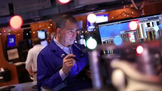 Traders work on the floor of the New York Stock Exchange during morning trading on November 26, 2024 in New York City.