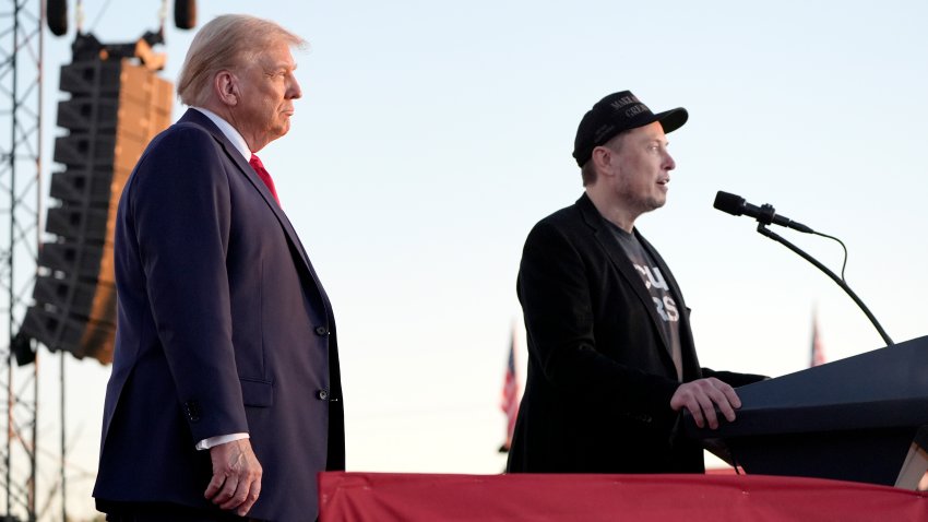 Tesla and SpaceX CEO Elon Musk speaks as Republican presidential nominee former President Donald Trump listens at a campaign event at the Butler Farm Show, Saturday, Oct. 5, 2024, in Butler, Pa.