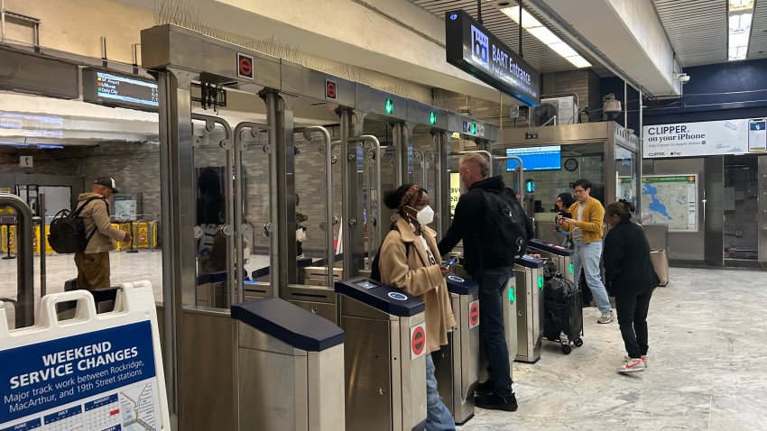 BART riders enter and exit through new fare gates.