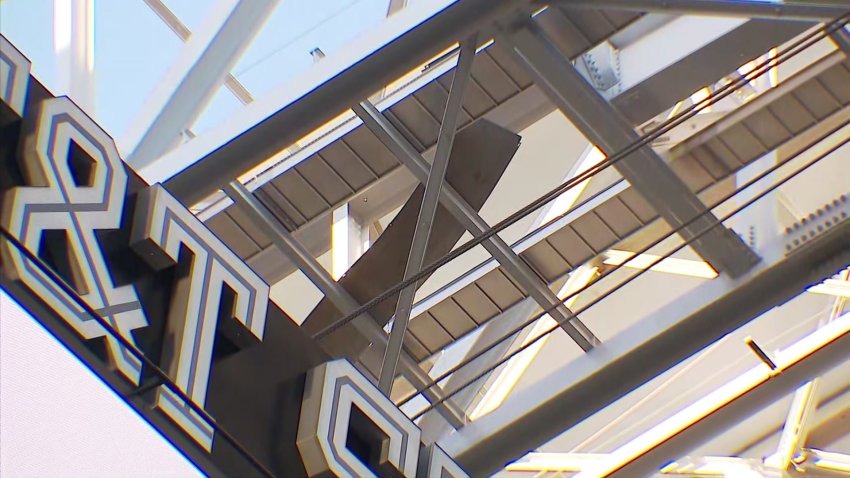 Piece of metal stuck in rafters after falling from the roof of AT&T Stadium.