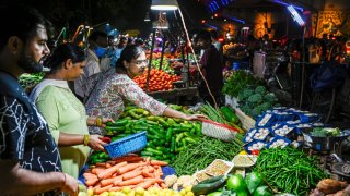 People buying vegetables at a local market in Noida, Uttar Pradesh on August 22, 2023. (Photo by Chandradeep Kumar/ The India Today Group via Getty Images)