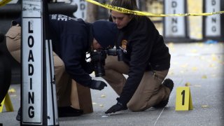 Police place bullet casing markers outside of a Hilton Hotel in Midtown Manhattan where United Healthcare CEO Brian Thompson was fatally shot on December 04, 2024 in New York City.