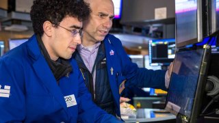 Traders work at the New York Stock Exchange on Dec. 17, 2024.