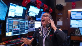 Traders work on the New York Stock Exchange (NYSE) floor in New York City. 