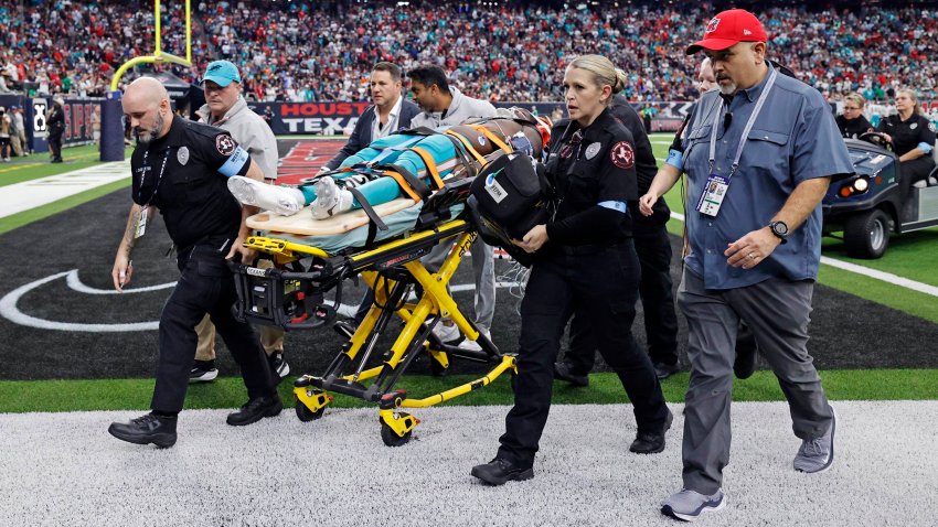 Miami Dolphins wide receiver Grant DuBose (88) is taken off the field on a stretcher