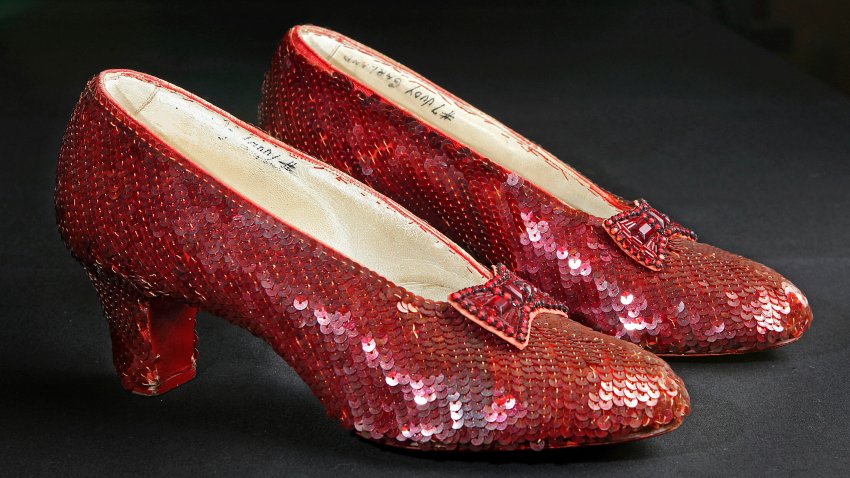 Sequin-covered ruby slippers worn by Judy Garland in “The Wizard of Oz” appear at the offices of Profiles in History in Calabasas, Calif. on Nov. 9, 2001.