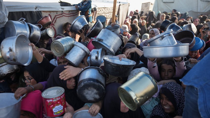 FILE - Palestinian women and girls struggl