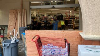 Cleanup and repair work at a Lucky grocery store that was burgled.