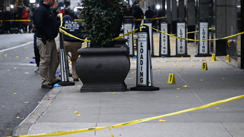 File. DECEMBER 4: Police officers investigate the scene where UnitedHealthcare CEO Brian Thompson was fatally shot in Midtown Manhattan near a hotel on 54th Street between 6th and 7th Avenues on December 04, 2024 in New York, United States.