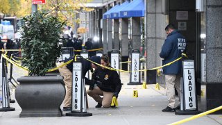 Police officers investigate the scene