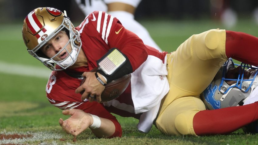 SANTA CLARA, CALIFORNIA – DECEMBER 30: Brock Purdy #13 of the San Francisco 49ers scores a rushing touchdown against the Detroit Lions during the second quarter at Levi’s Stadium on December 30, 2024 in Santa Clara, California. (Photo by Ezra Shaw/Getty Images)