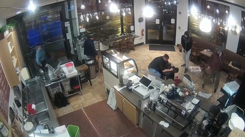 A sceenshot from surveillance video shows a struggle at a San Francisco cafe last Friday. (Dec. 16, 2024)