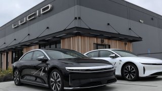 Brand new Lucid electric cars sit parked in front of a Lucid Studio showroom in San Francisco on May 24, 2024.