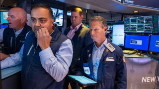 Traders work on the floor of the New York Stock Exchange on the first day of trading of the new year on Jan. 2, 2025.