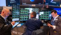 Traders work on the floor of the New York Stock Exchange (NYSE) on the first day of trading of the new year on January 02, 2025 in New York City. 