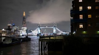 Night view looking across the River Thames to the skyline of Tower Bridge and The Shard on 3rd December 2024 in London, United Kingdom.