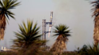 SpaceX's mega rocket Starship booster returns to the launch pad during a test flight from Starbase in Boca Chica, Texas, Thursday, Jan. 16, 2025.