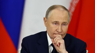 Russian President Vladimir Putin attends a documents signing ceremony with Iranian President following their talks at the Kremlin in Moscow on January 17, 2025.