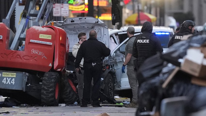 Emergency services attend the scene on Bourbon Street after a vehicle drove into a crowd on New Orleans' Canal and Bourbon Street, Wednesday Jan. 1, 2025.