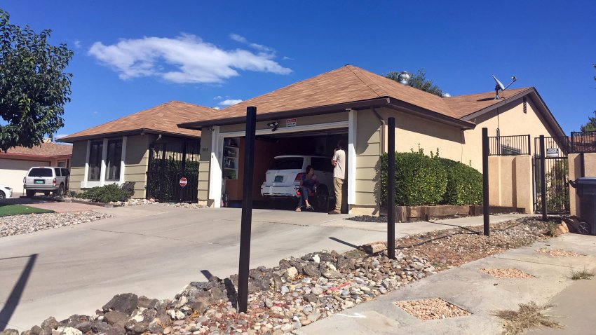 FILE - Poles for a new fence stand outside the house used in the AMC-TV series "Breaking Bad"