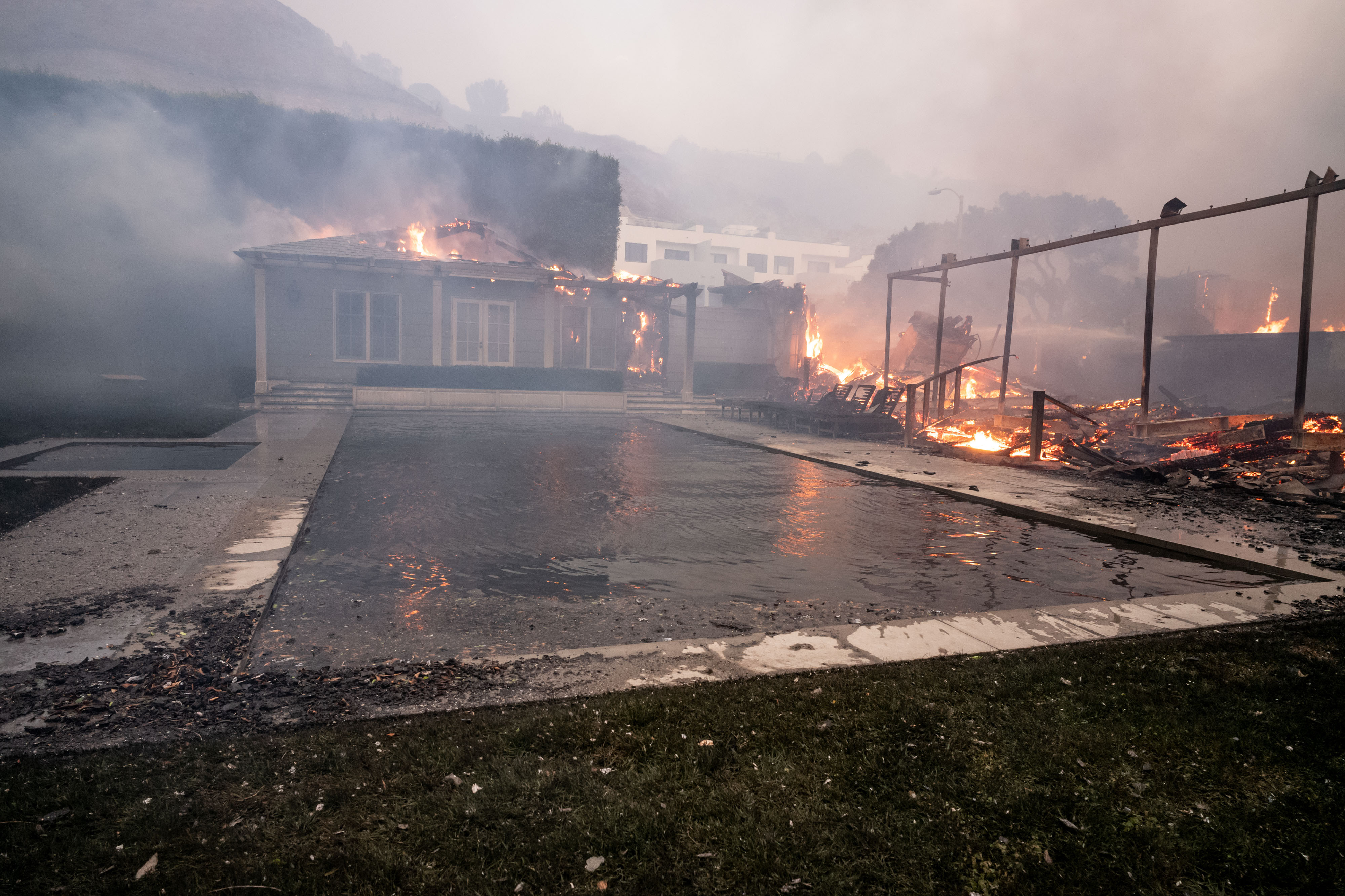 Luxury beachfront homes go up in flames in Malibu along Pacific Coast Highway near Carbon Canyon Road in the Palisades Fire on Jan. 8, 2025.