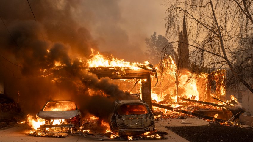 Vehicles burn during the Eaton Fire in Altadena, Calif., US, on Wednesday, Jan. 8, 2025.