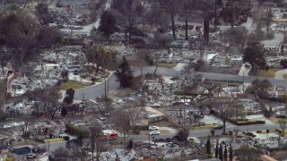 ALTADENA CALIFORNIA – JANUARY 12: A general view of destroyed houses in a neighborhood that was destroyed by the Eaton Fire which remains without electricity or water on January 12, 2025 in Altadena, California. People who stayed throughout the fire would now not be allowed back in if they leave their remaining few houses that survived.The death toll from the Eaton Fire rose to 16 today as search and rescue teams go through the ruins of thousands of homes. More than 7,000 structures, mostly homes, were damaged or destroyed as a powerful Santa Ana wind event pushed flames farther into the city than even many fire experts expected. (Photo by David McNew/Getty Images)