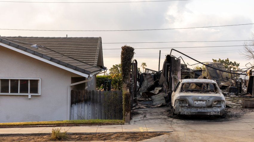 A home destroyed by the Eaton Fire next to an intact home in Pasadena, California, US, on Friday, Jan. 17, 2025. The Eaton Fire has become the fifth-deadliest in state history, killing at least 16 people and consuming more than 7,000 structures, according to Cal Fire. Photographer: Jill Connelly/Bloomberg via Getty Images