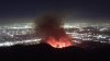 Brush fire fanned by strong winds burns in Eaton Canyon near Altadena