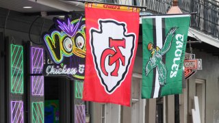 Kansas City Chiefs and Philadelphia Eagles flags at Voodoo Chicken & Daiquiris restaurant on Bourbon Street prior to Super Bowl 59.
